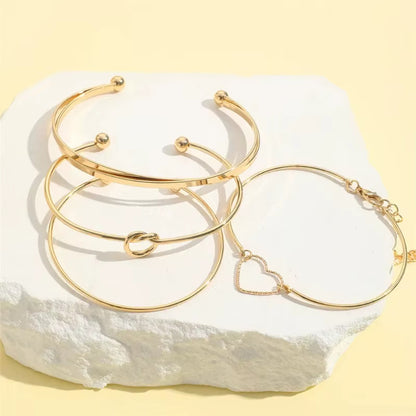 4pc Gold Twist Bracelet Set